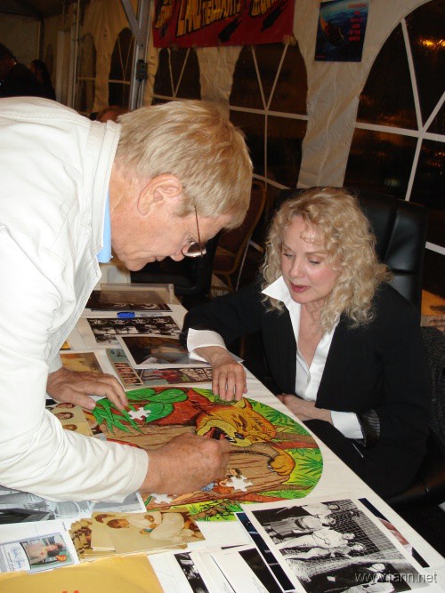 Gary signs puzzle for Heather