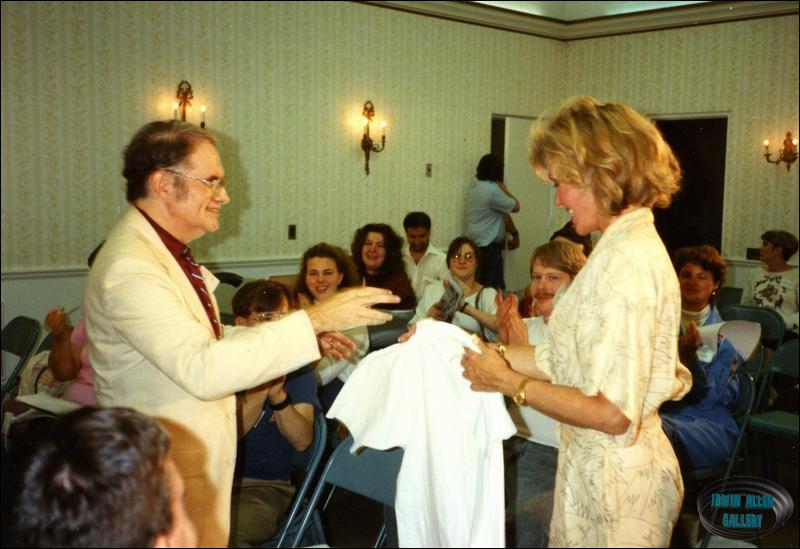 Dr. Fred presents T-Shirt to Deanna Lund
