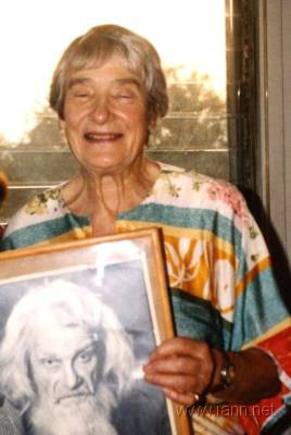 Elizabeth Emanuel with portrait of Jonathan Harris