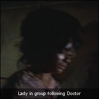 Lady in group following Doctor
