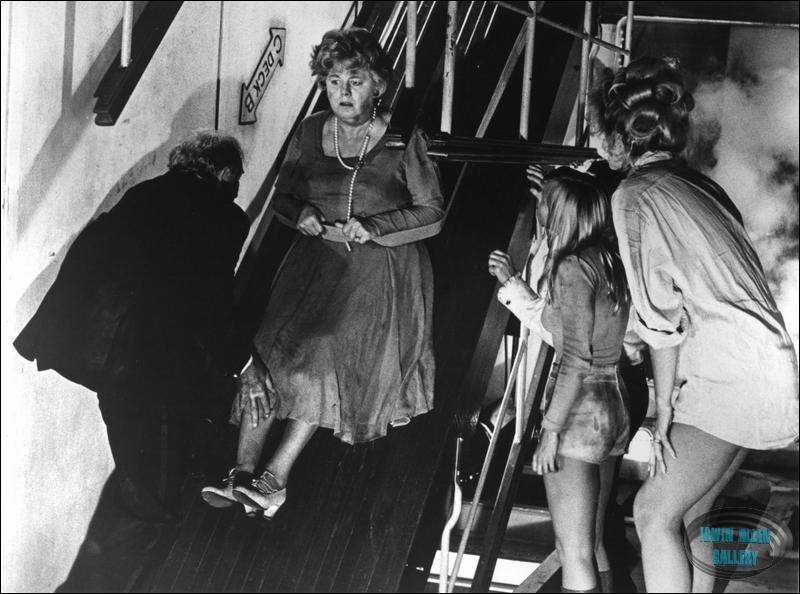 Shelley Winters being pulled up slope