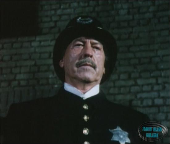 Policeman who catches Adams with Sharkey