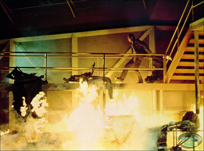 Paul Newman amongst burnt wreckage